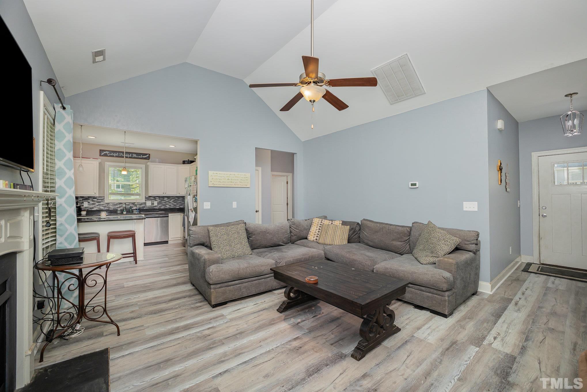 16 Chaparral Trail Garner, NC 27529 - Photo 7 of 29 a living room with furniture and a wooden floor