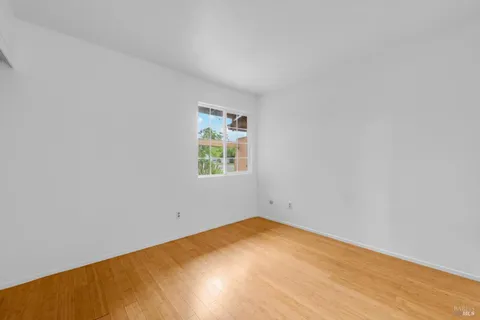 an empty room with a empty space and a window