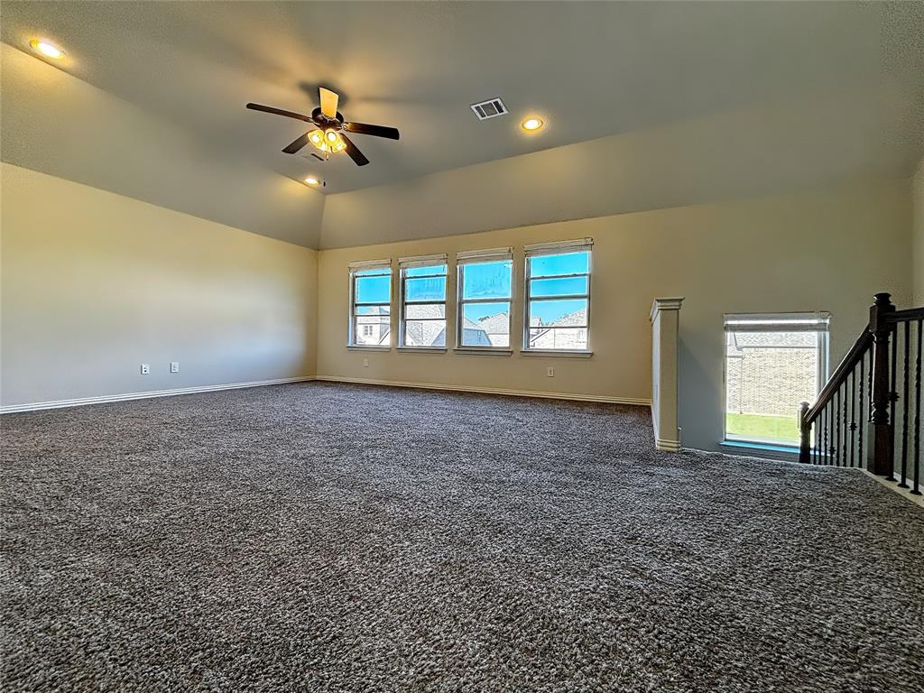 3037 Crestwater Ridge Keller, TX 76248 - Photo 17 of 25 a view of a livingroom with a ceiling fan and window