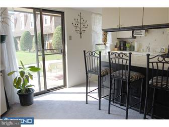11849B Academy Road, Unit A49 Philadelphia, PA 19154 - Photo 4 of 6 a view of a dining room with furniture window and outside view