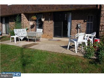 11849B Academy Road, Unit A49 Philadelphia, PA 19154 - Photo 6 of 6 a lawn chairs sitting in front of a house
