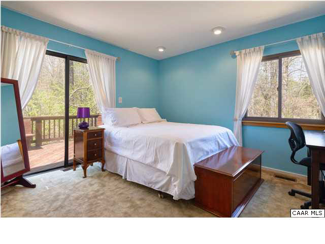 100 Ivy Ridge Road Charlottesville, VA 22901 - Photo 15 of 21 a bedroom with a bed a window and walk in closet