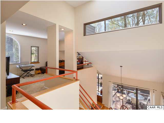 100 Ivy Ridge Road Charlottesville, VA 22901 - Photo 7 of 21 a living room with furniture a flat screen tv and a table