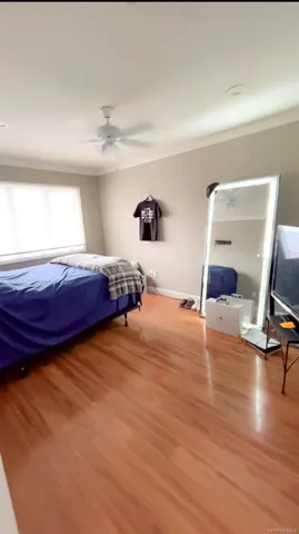 a bedroom with a bed and a chair