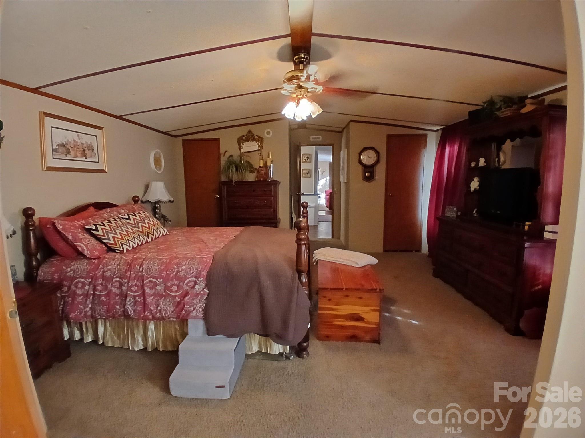 2157 Ross Cauthen Road Lancaster, SC 29720 - Photo 13 of 22 a bedroom with furniture and a chandelier
