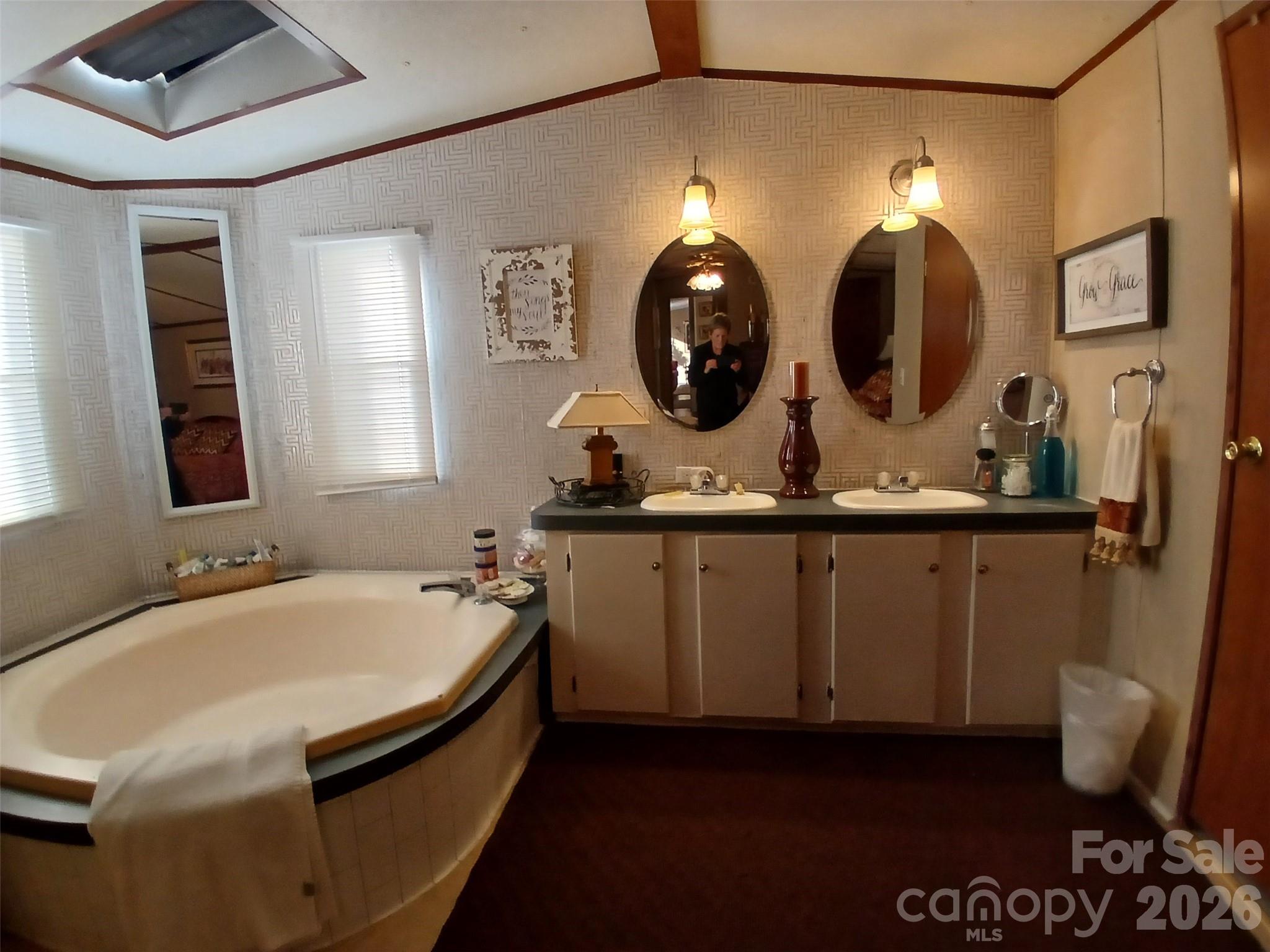 2157 Ross Cauthen Road Lancaster, SC 29720 - Photo 14 of 22 a bathroom with a double vanity sink and a mirror