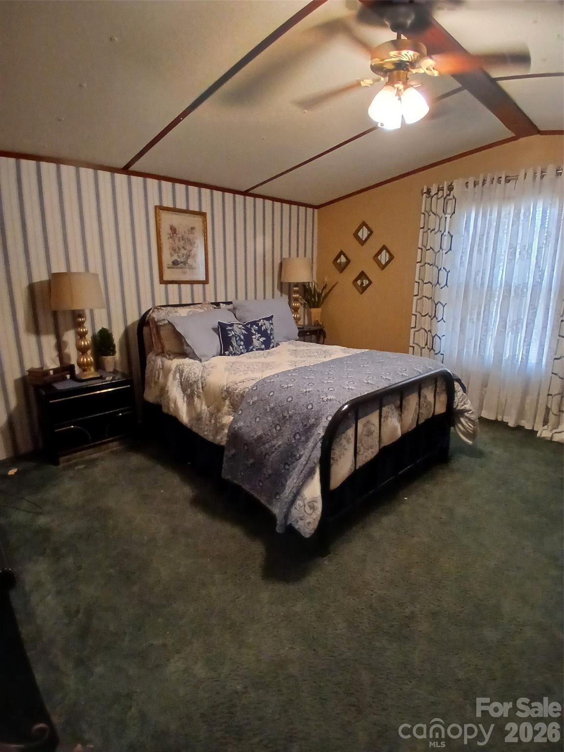 2157 Ross Cauthen Road Lancaster, SC 29720 - Photo 15 of 22 a bed sitting in a room next to a window