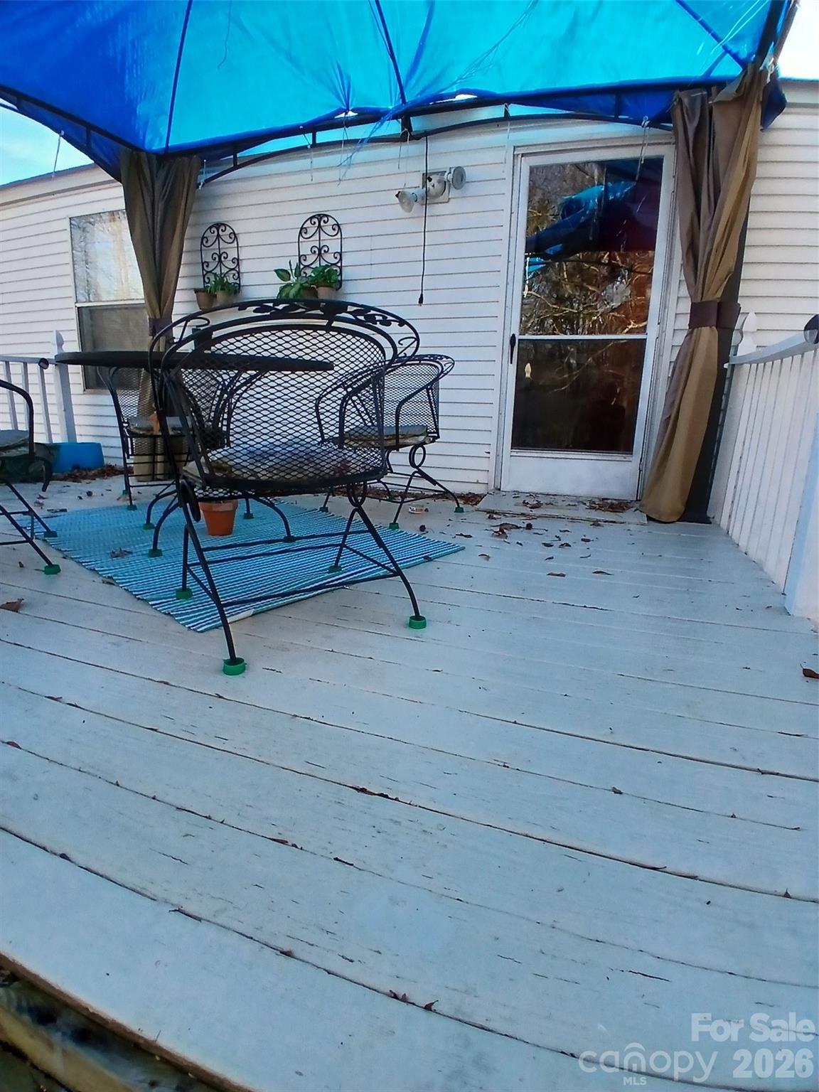 2157 Ross Cauthen Road Lancaster, SC 29720 - Photo 17 of 22 a view of a patio with table and chairs under an umbrella