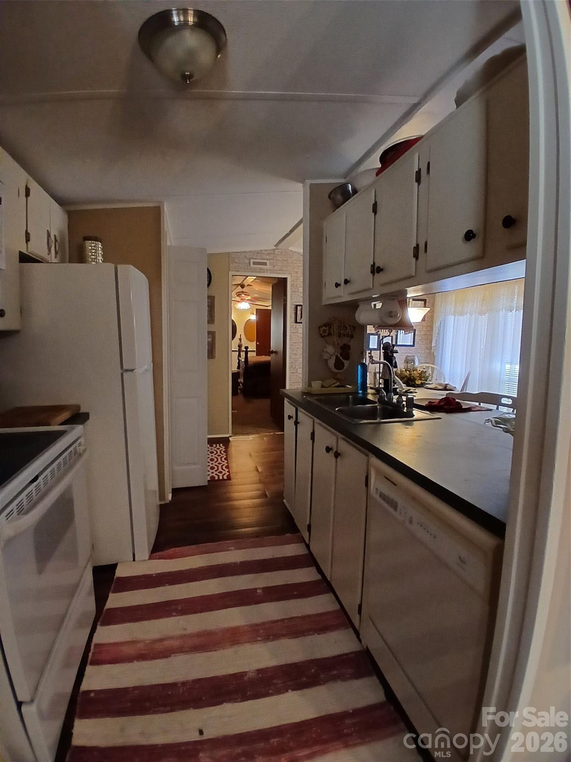 2157 Ross Cauthen Road Lancaster, SC 29720 - Photo 10 of 22 a kitchen with stainless steel appliances a refrigerator sink and cabinets