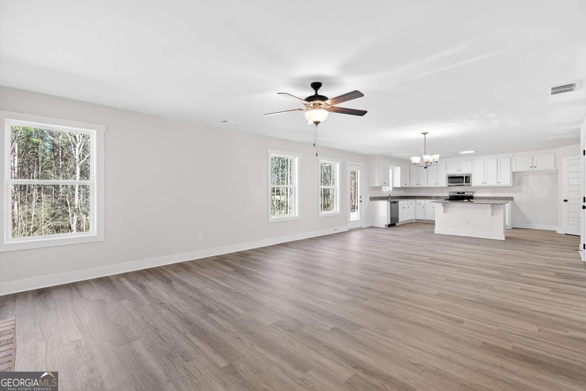 538 Oil Mill Road, Unit 8 Martin, GA 30557 - Photo 12 of 50 a view of kitchen with cabinets and wooden floor