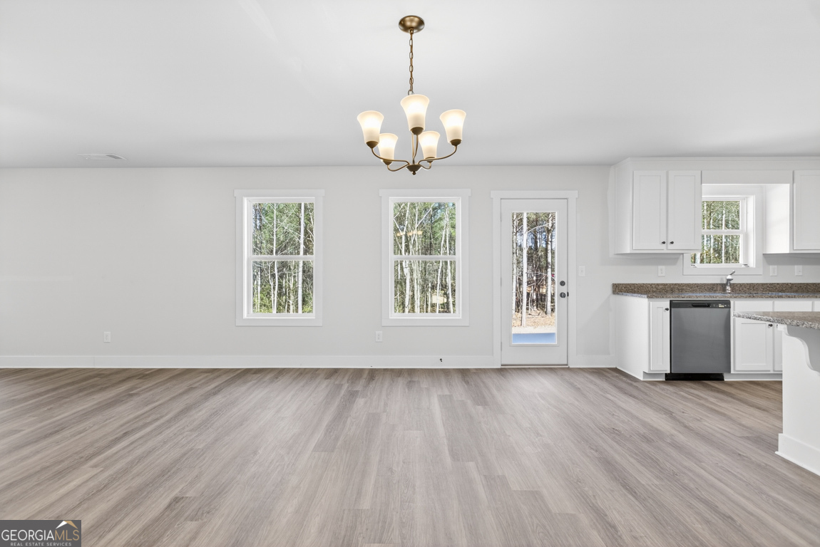 538 Oil Mill Road, Unit 8 Martin, GA 30557 - Photo 15 of 50 a view of an empty room with a window and wooden floor