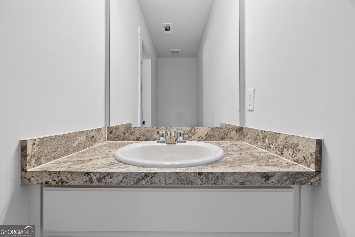 538 Oil Mill Road, Unit 8 Martin, GA 30557 - Photo 21 of 50 a bathroom with a granite countertop sink and a mirror