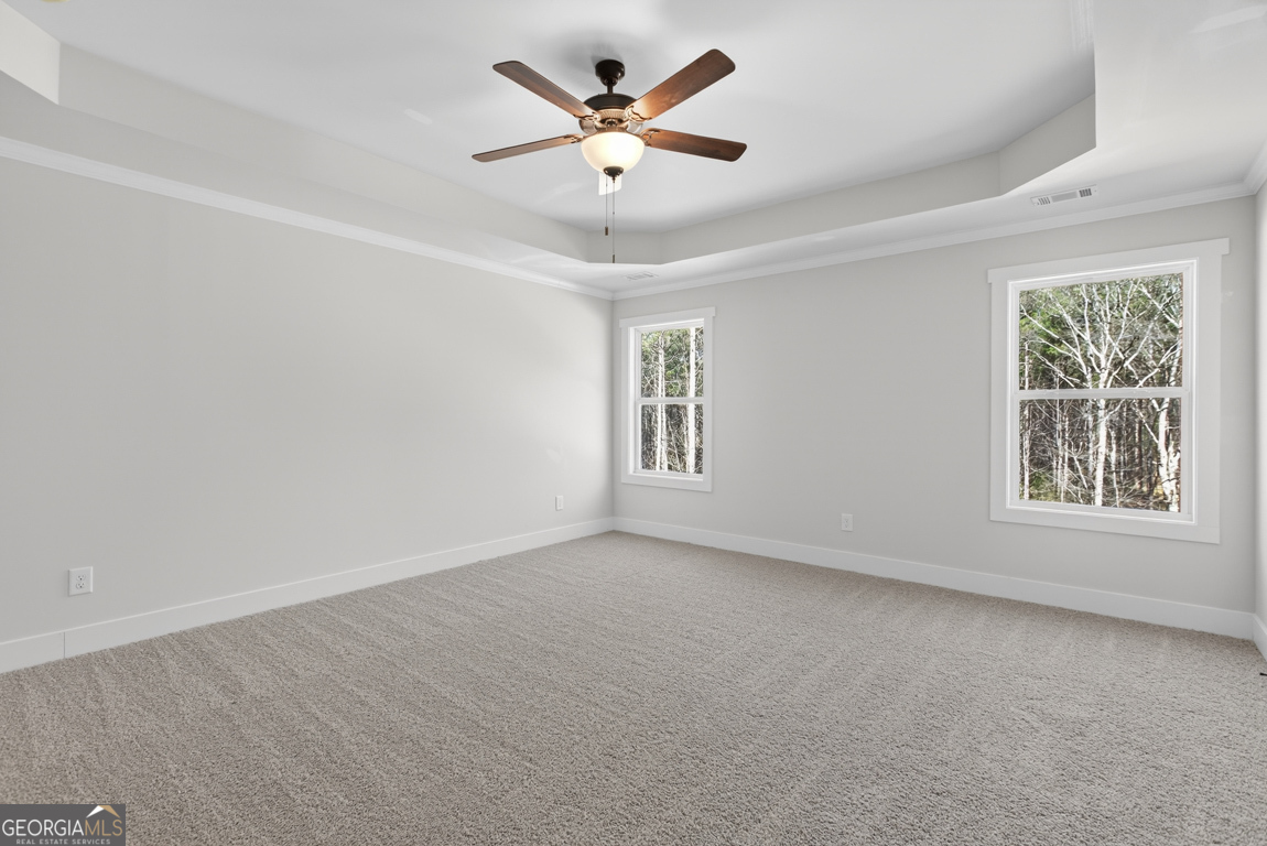 538 Oil Mill Road, Unit 8 Martin, GA 30557 - Photo 35 of 50 an empty room with windows and ceiling fan