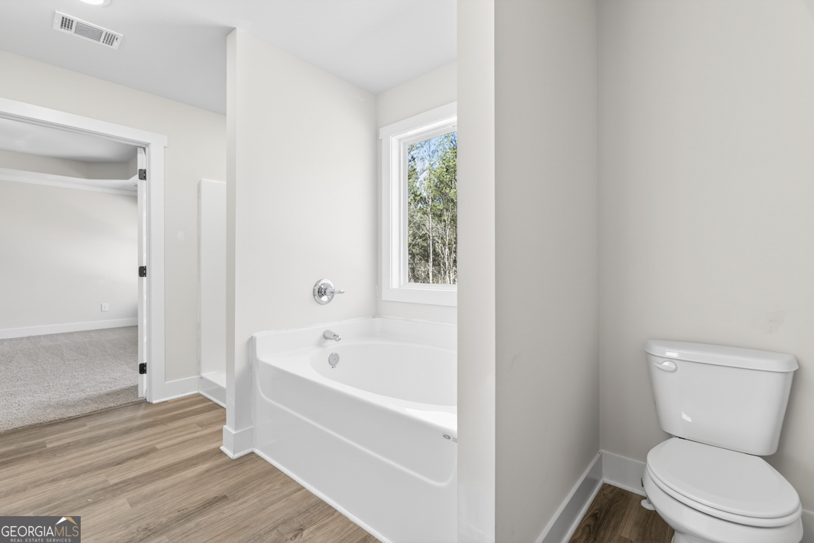 538 Oil Mill Road, Unit 8 Martin, GA 30557 - Photo 44 of 50 a bathroom with a toilet bathtub and shower