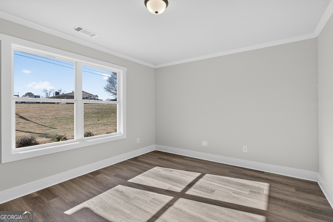 538 Oil Mill Road, Unit 8 Martin, GA 30557 - Photo 6 of 50 an empty room with wooden floor and windows