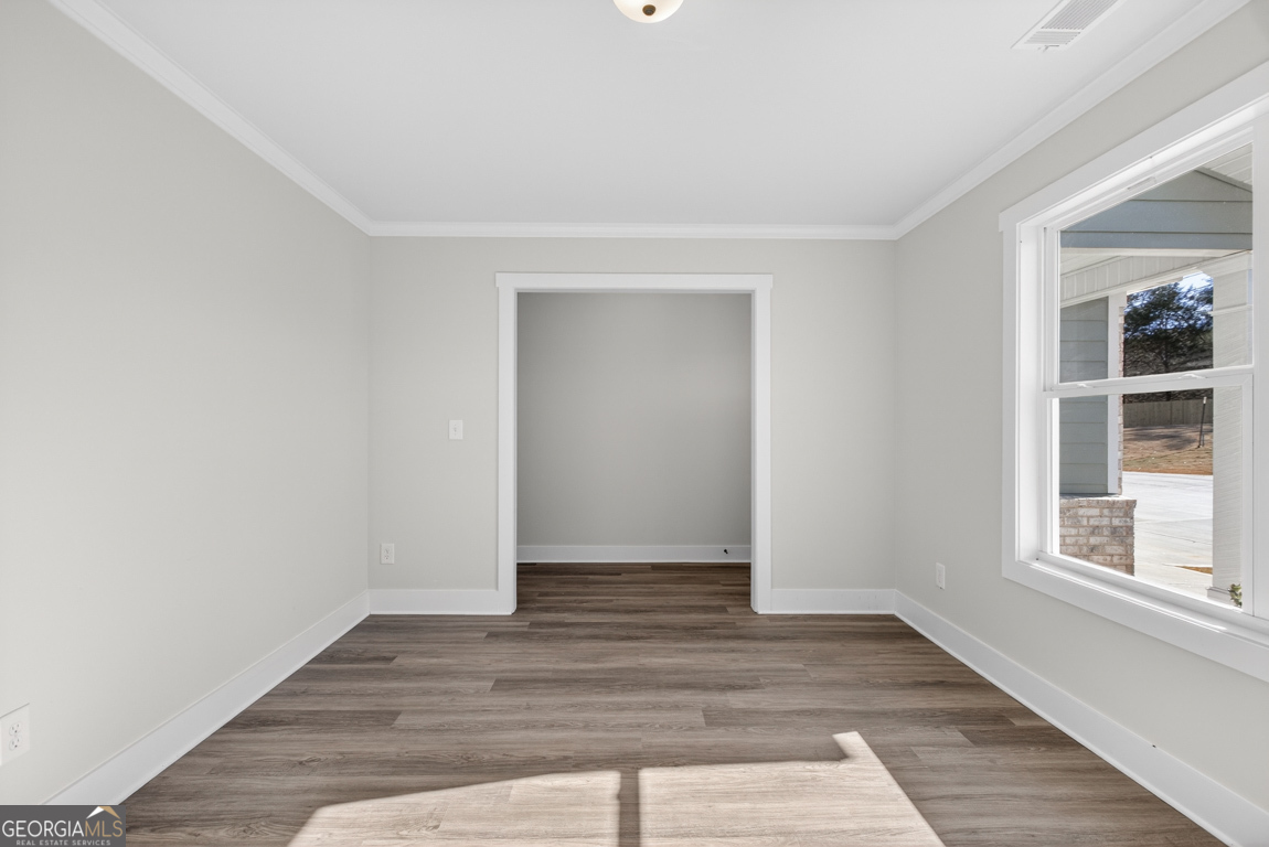 538 Oil Mill Road, Unit 8 Martin, GA 30557 - Photo 7 of 50 a view of an empty room with wooden floor and a window