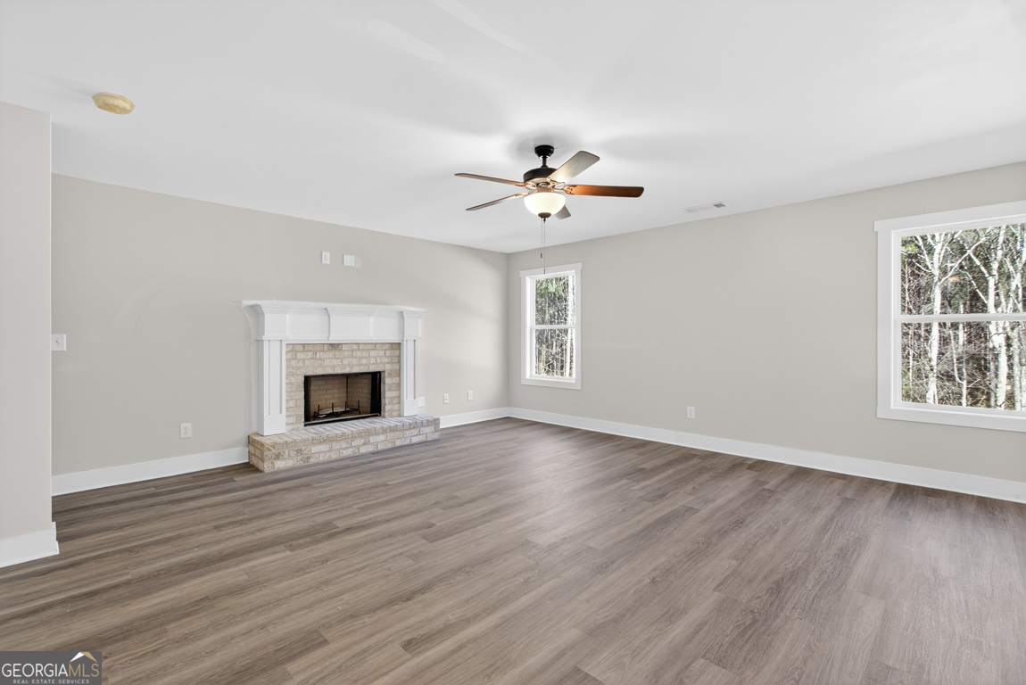 538 Oil Mill Road, Unit 8 Martin, GA 30557 - Photo 8 of 50 a view of an empty room with wooden floor and a window