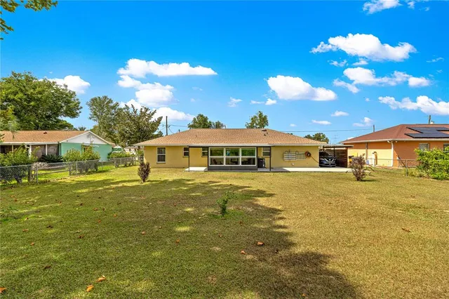 a front view of a house with yard