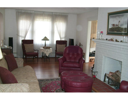 12 Maple Street Marblehead, MA 01945 - Photo 5 of 14 a living room with furniture and a fireplace