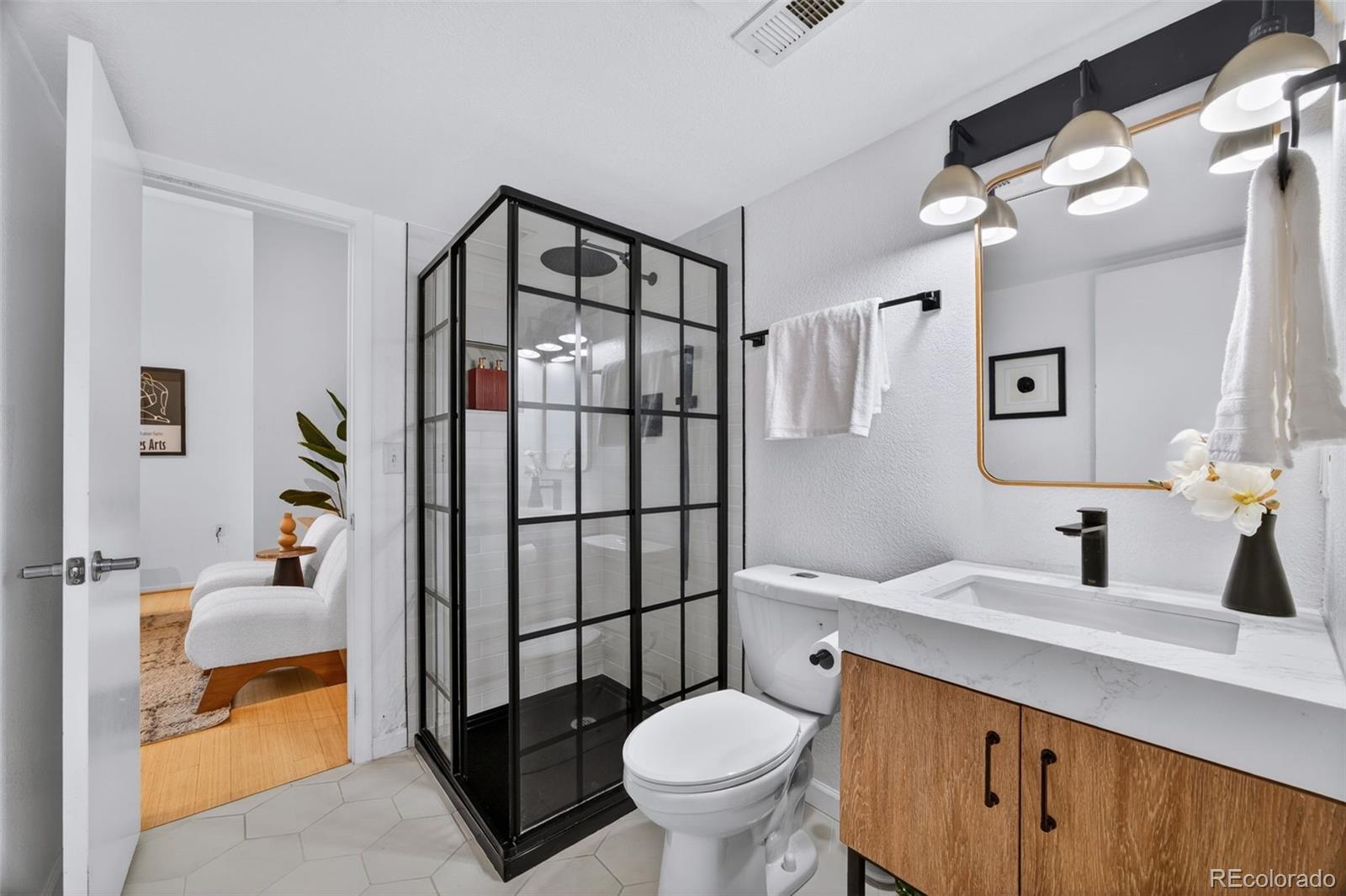 3225 Blake Street, Unit 20 Denver, CO 80205 - Photo 21 of 47 a bathroom with a sink toilet and shower