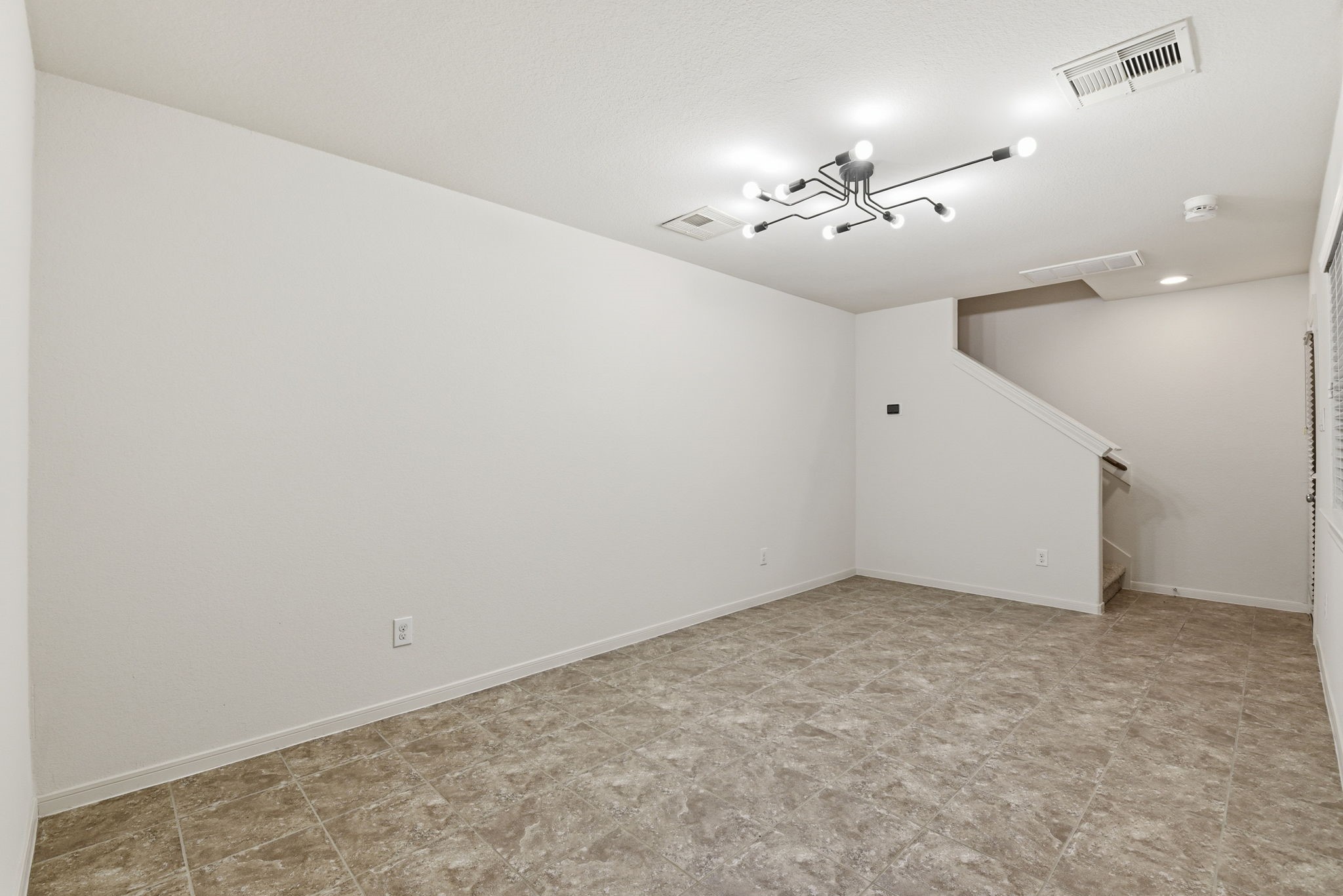 3209 Clearview Circle Houston, TX 77025 - Photo 11 of 40 an empty room with a chandelier fan and closet