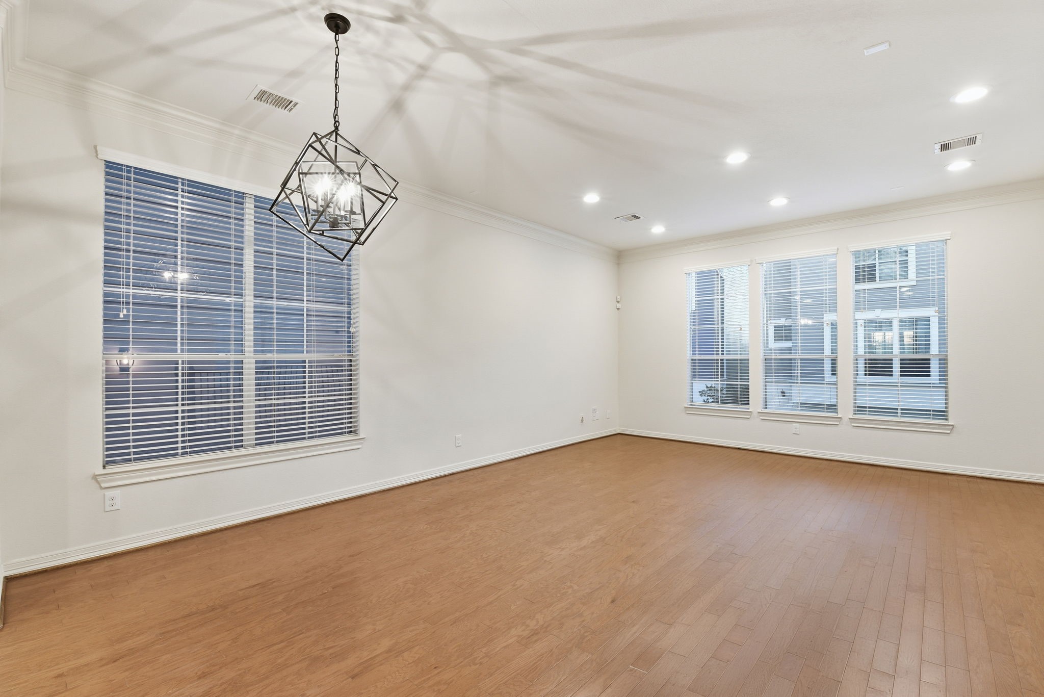 3209 Clearview Circle Houston, TX 77025 - Photo 13 of 40 a view of an empty room with a window and chandelier