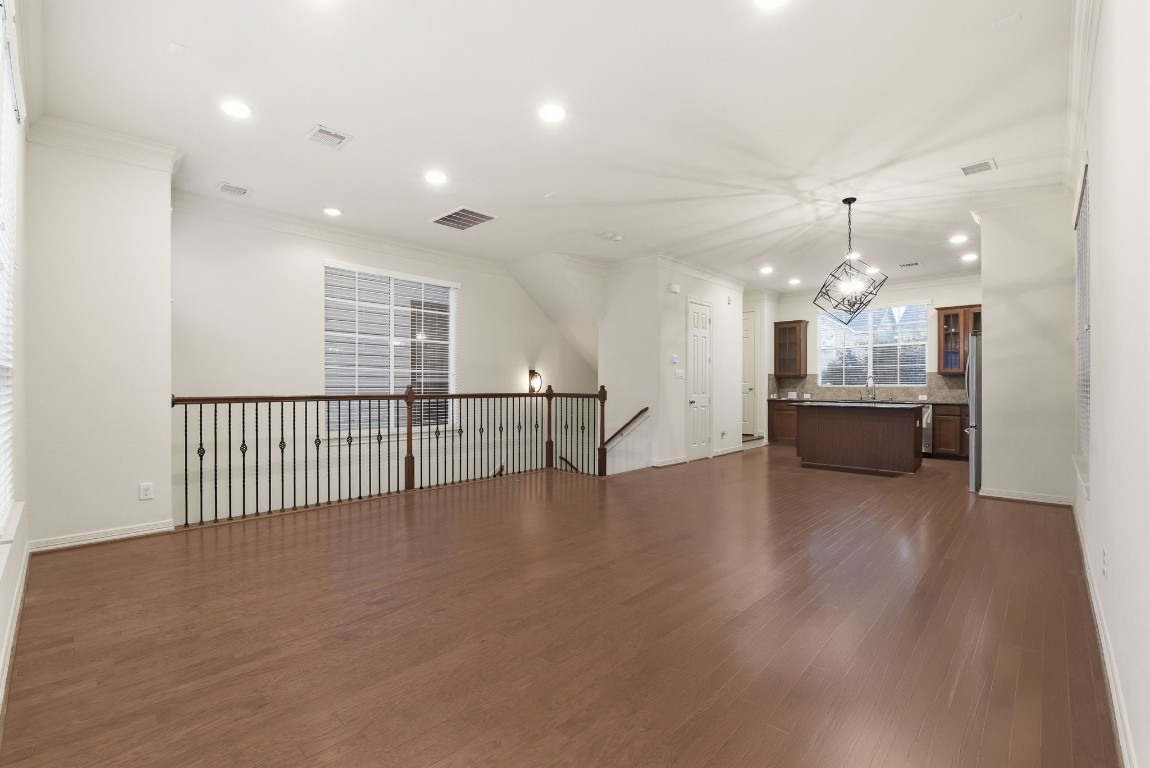 3209 Clearview Circle Houston, TX 77025 - Photo 15 of 40 a view of a big room with wooden floor and windows