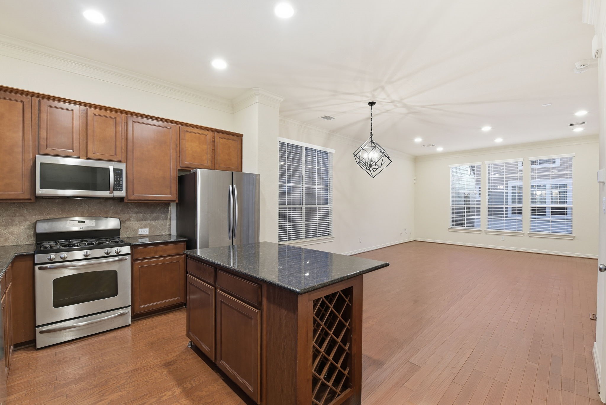 3209 Clearview Circle Houston, TX 77025 - Photo 20 of 40 a kitchen with stainless steel appliances granite countertop a stove and a refrigerator