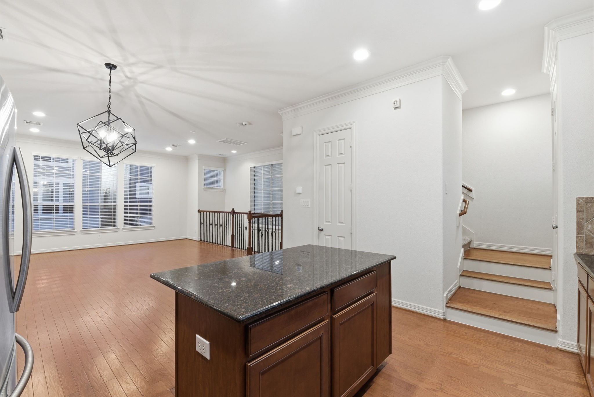 3209 Clearview Circle Houston, TX 77025 - Photo 21 of 40 a view of a room with wooden floor and chandelier
