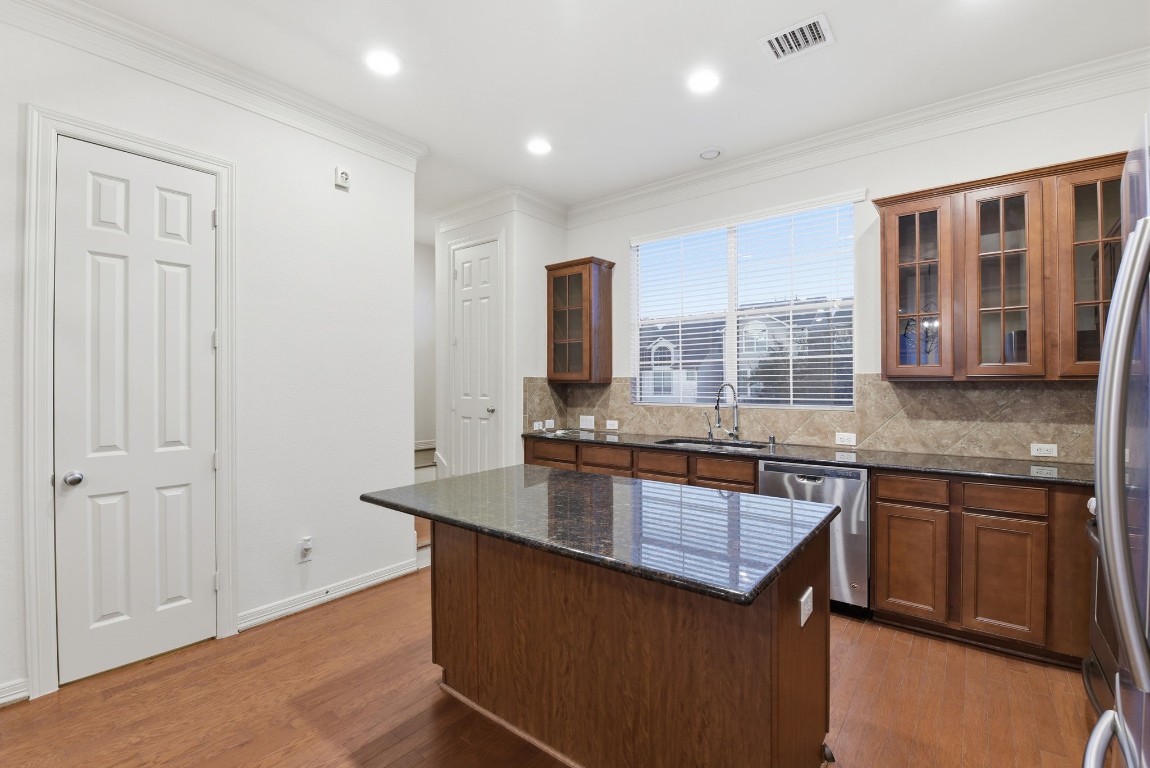 3209 Clearview Circle Houston, TX 77025 - Photo 22 of 40 a kitchen with granite countertop a stove and a sink