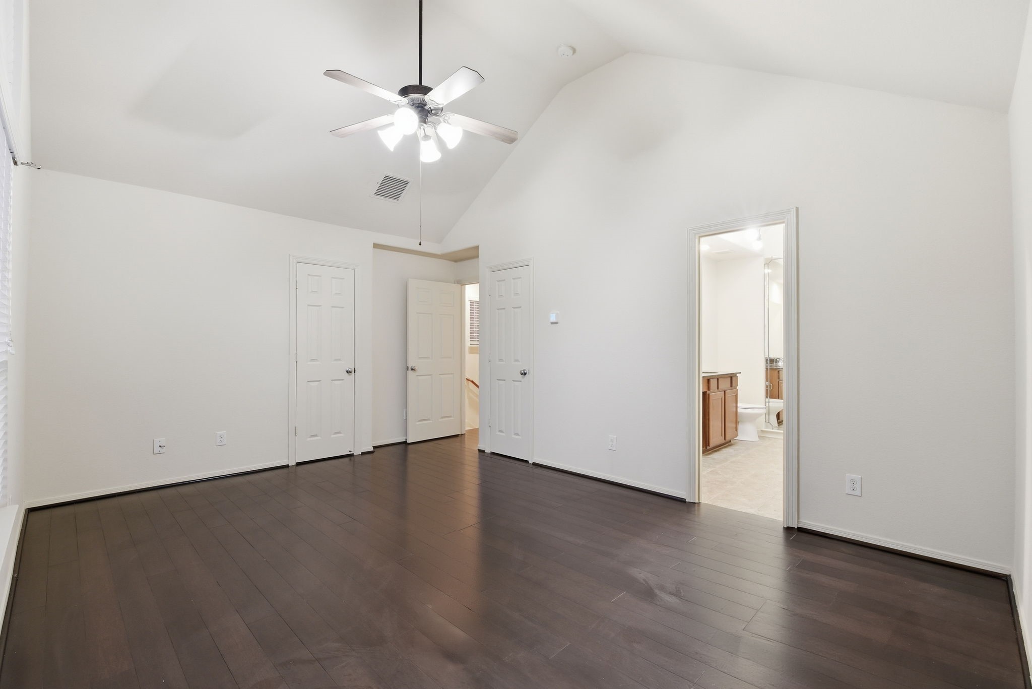 3209 Clearview Circle Houston, TX 77025 - Photo 30 of 40 an empty room with wooden floor chandelier fan and windows