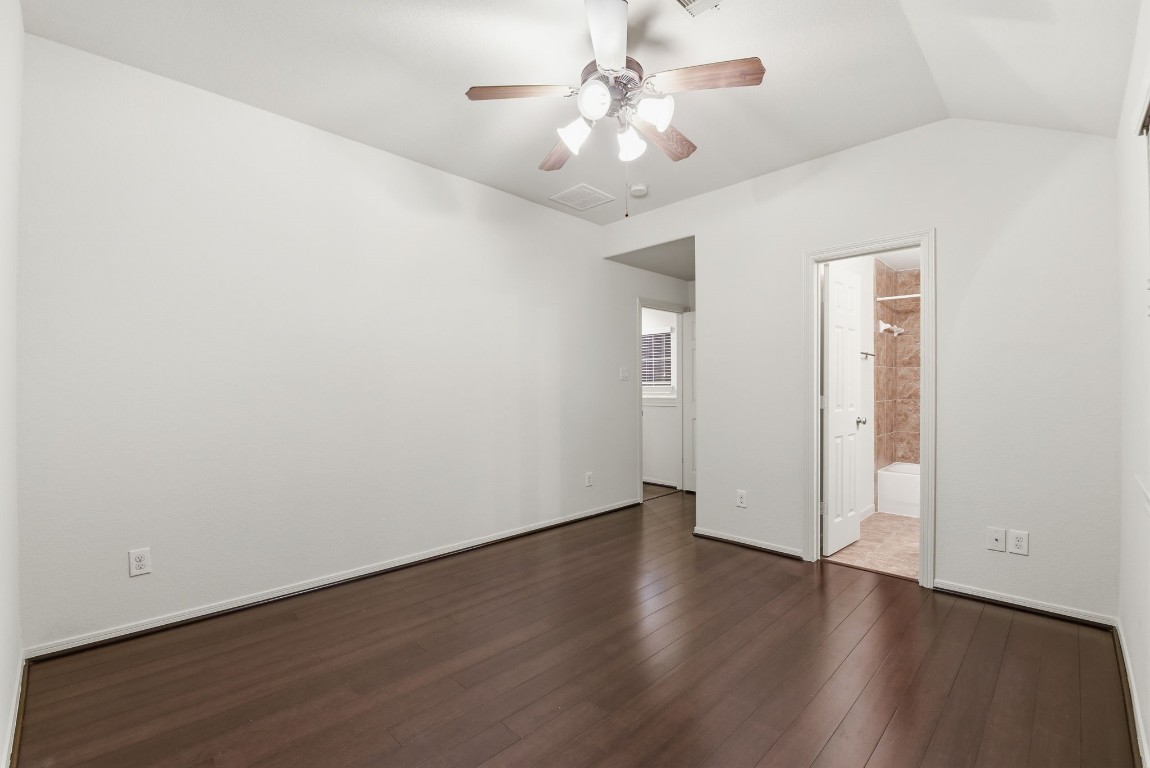 3209 Clearview Circle Houston, TX 77025 - Photo 36 of 40 an empty room with wooden floor and a ceiling fan