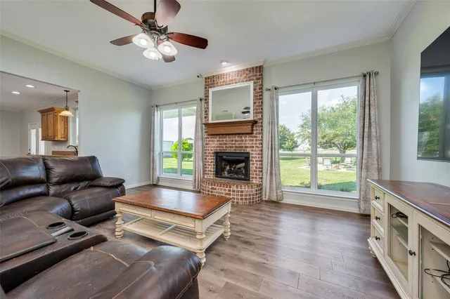 a living room with furniture fireplace and flat screen tv