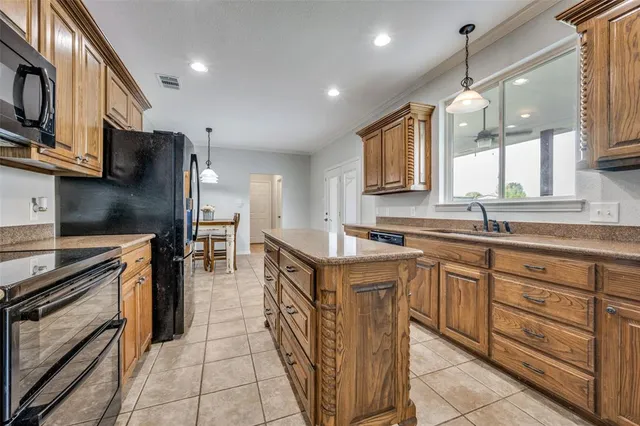 a kitchen with cabinets and appliances
