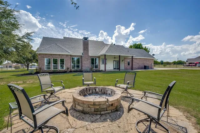 a view of a house with backyard porch and patio