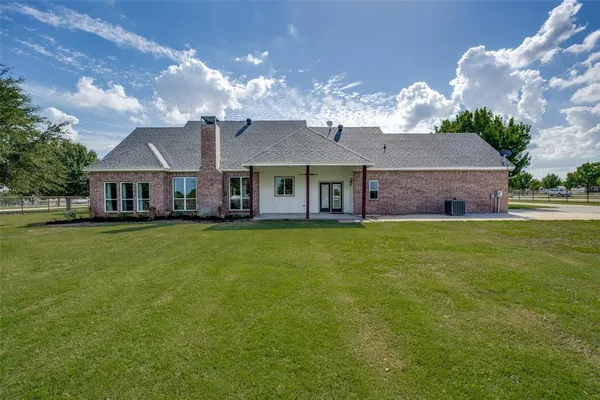 a view of a house with backyard porch and patio