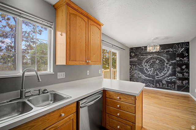 2058 California Avenue, Unit 2 Provo, UT 84606 - Photo 16 of 32 Kitchen featuring light wood cabinetry, a double basin stainless steel sink, and light countertops
