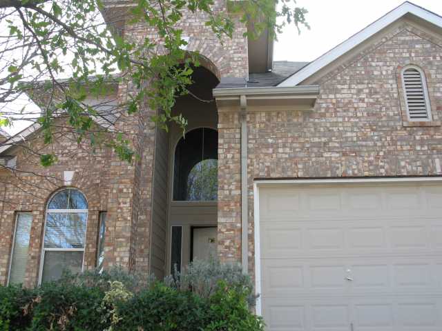 3305 Bratton Ridge Crossing Austin, TX 78728 - Photo 1 of 1 a front view of a house with plants