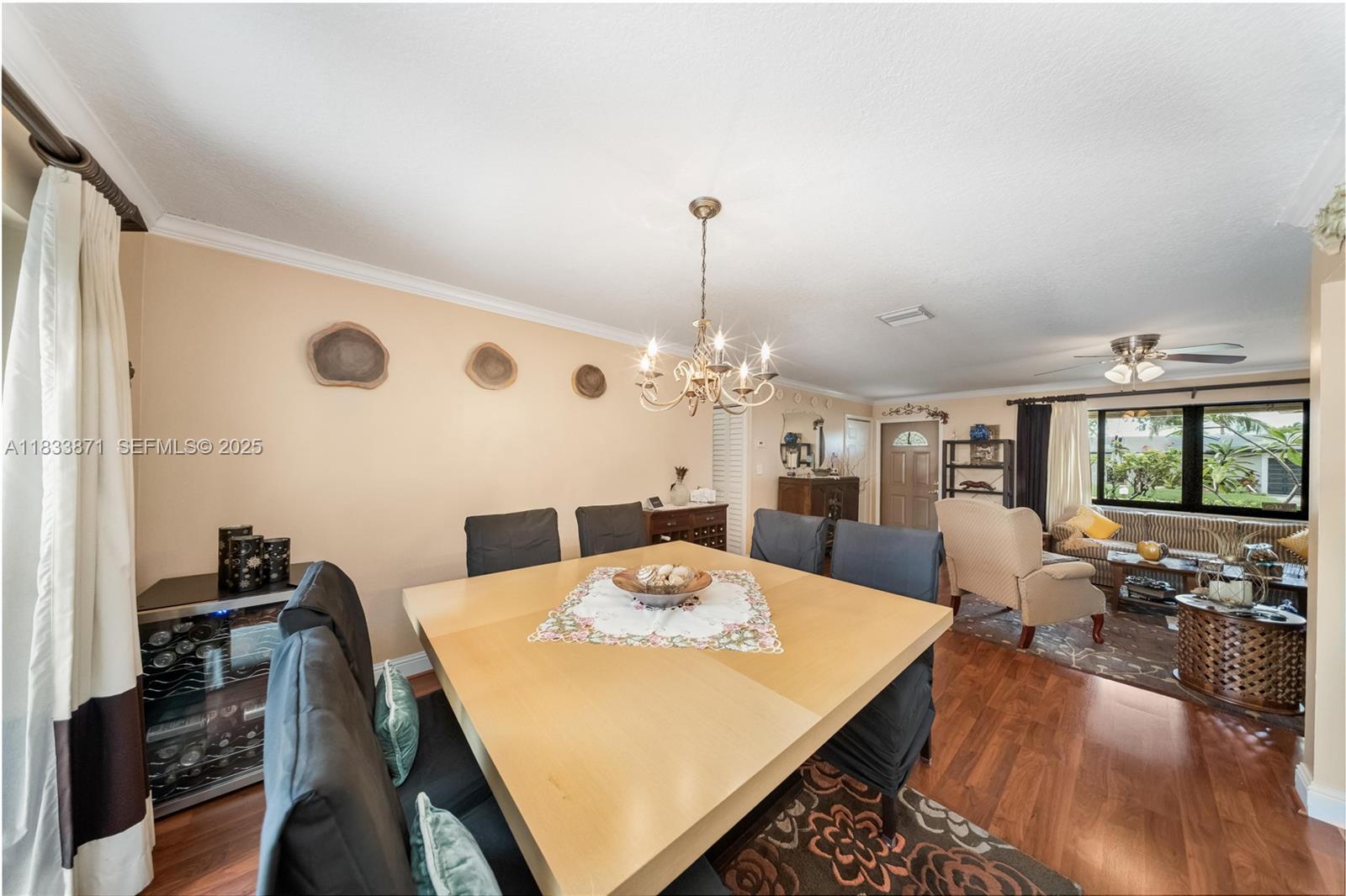 11193 Southwest 113th Terrace Miami, FL 33176 - Photo 18 of 43 a view of a dining room with furniture and wooden floor