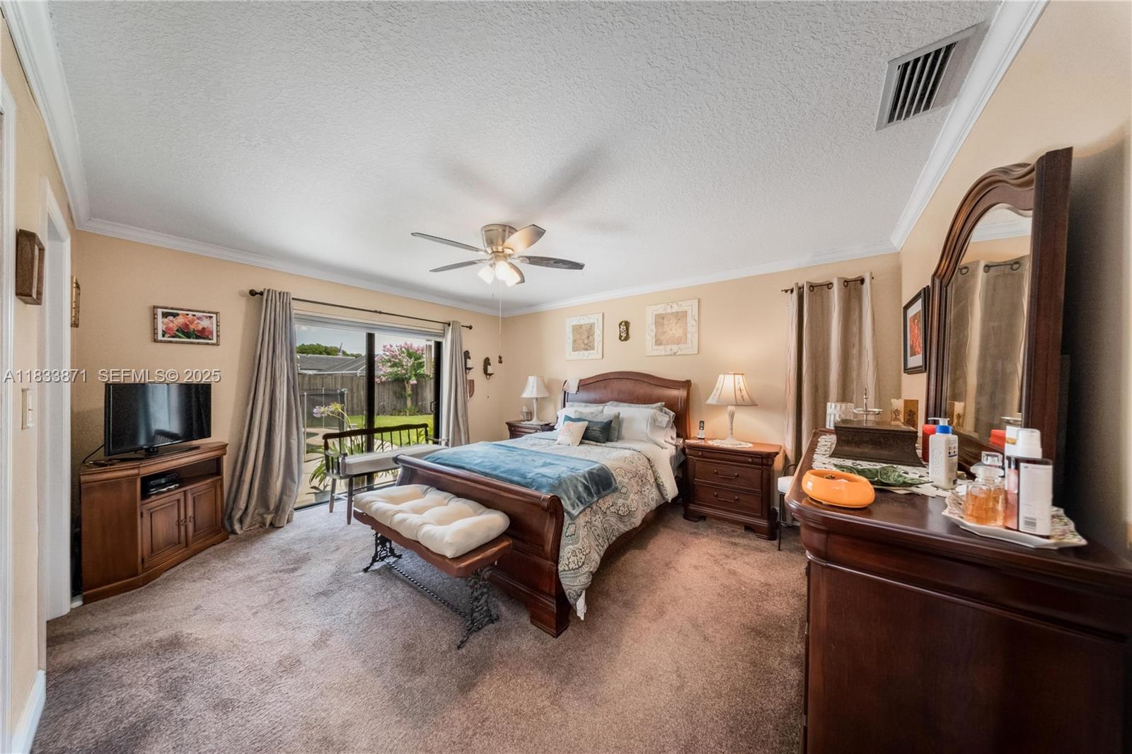 11193 Southwest 113th Terrace Miami, FL 33176 - Photo 19 of 43 a bed room with a bed and a television