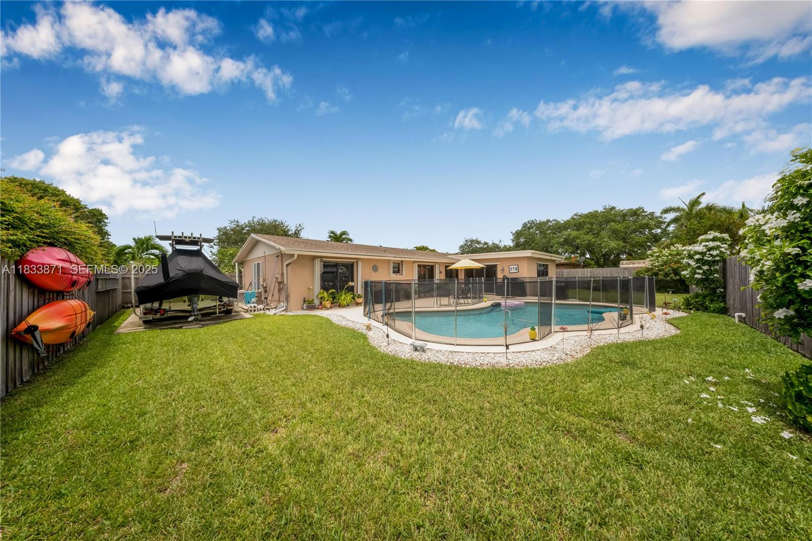 11193 Southwest 113th Terrace Miami, FL 33176 - Photo 2 of 43 a view of a house with a backyard porch and sitting area