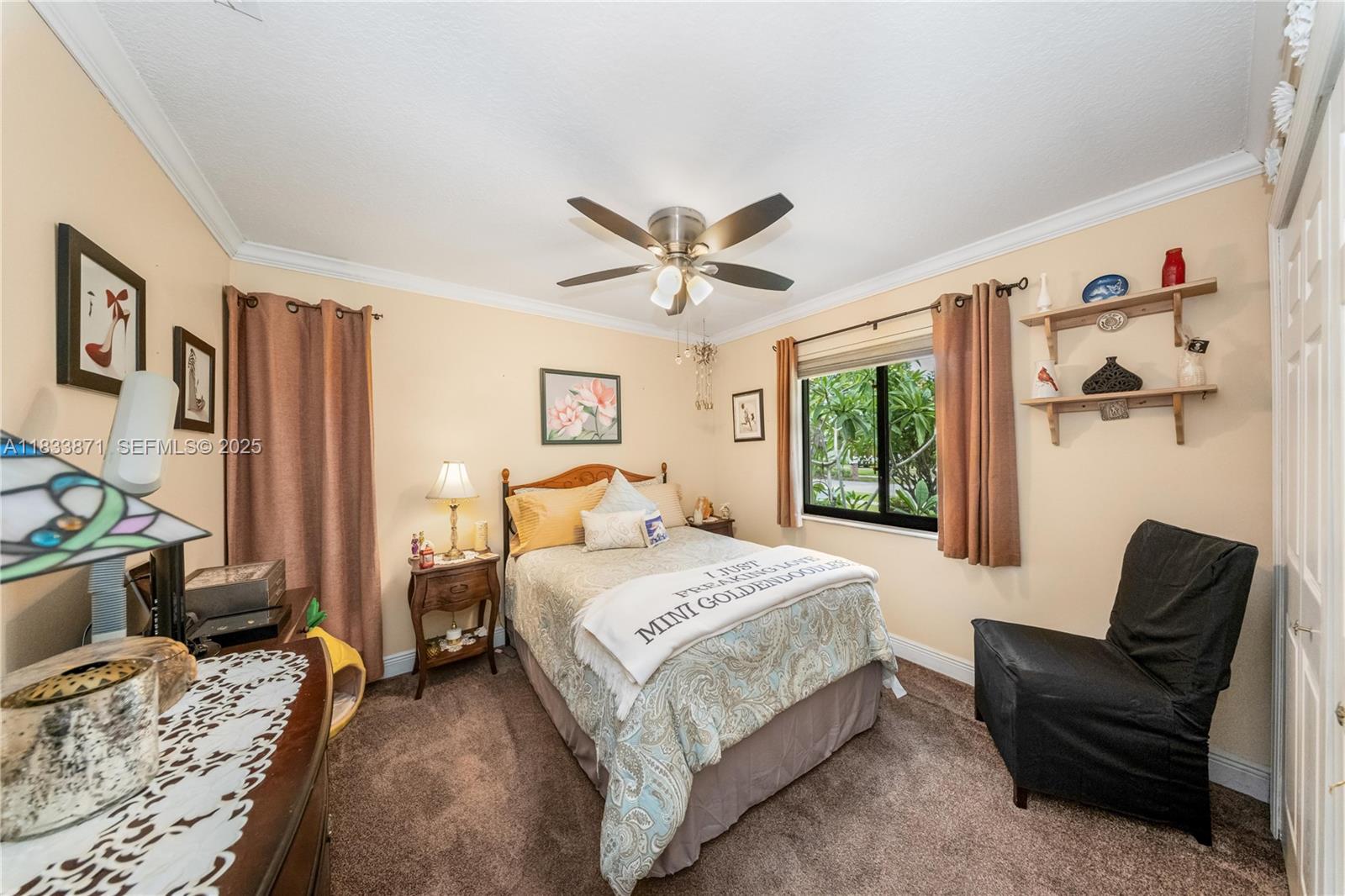 11193 Southwest 113th Terrace Miami, FL 33176 - Photo 23 of 43 a bedroom with a bed couch and window