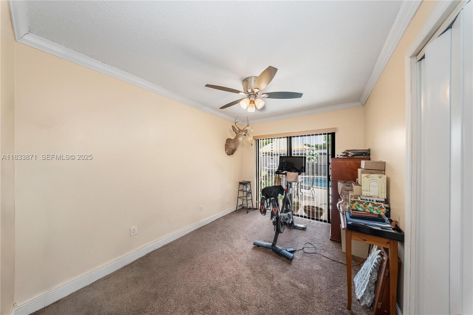 11193 Southwest 113th Terrace Miami, FL 33176 - Photo 27 of 43 a view of a workspace with furniture and a window