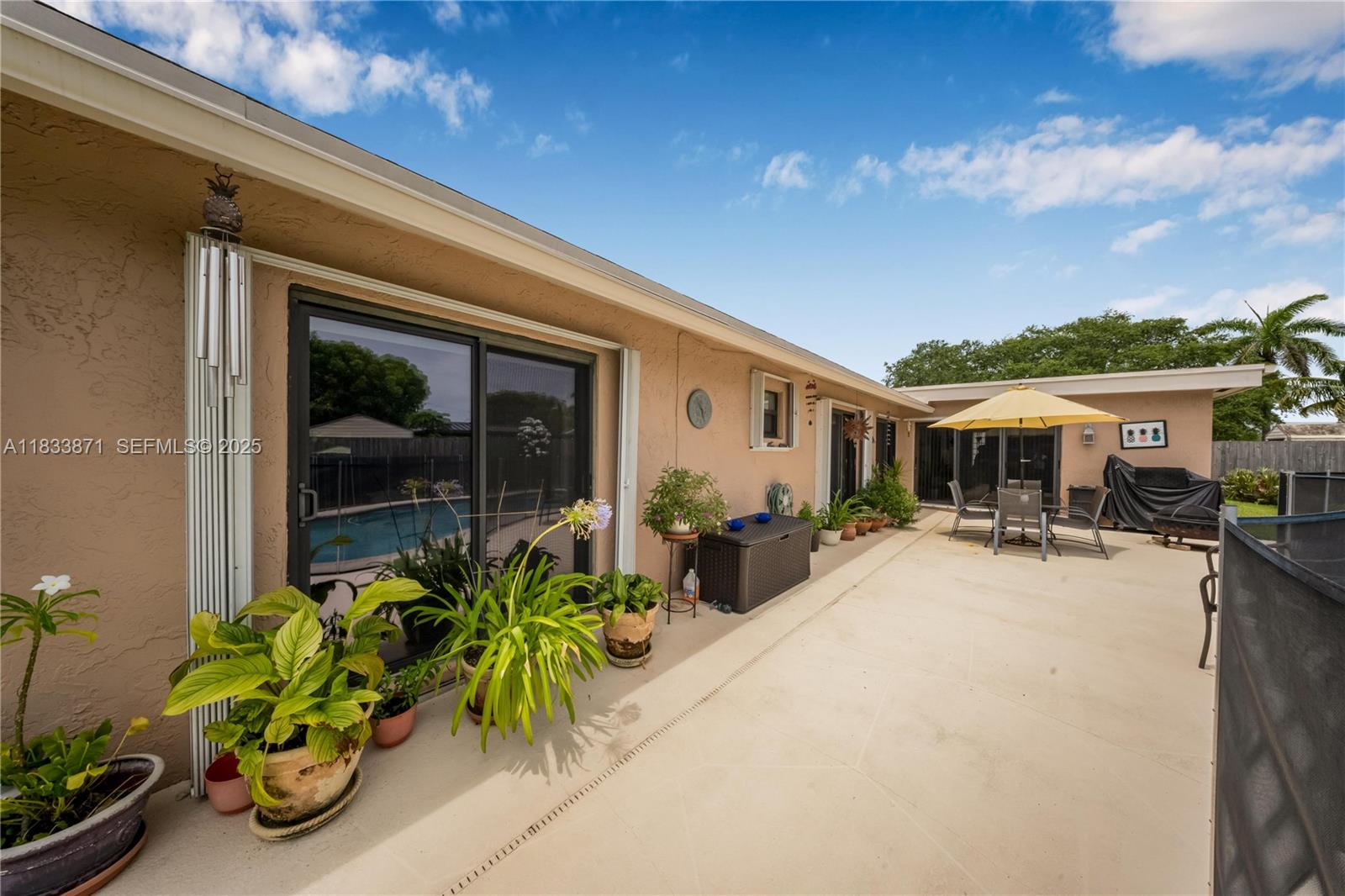 11193 Southwest 113th Terrace Miami, FL 33176 - Photo 31 of 43 a front view of a house with sitting area