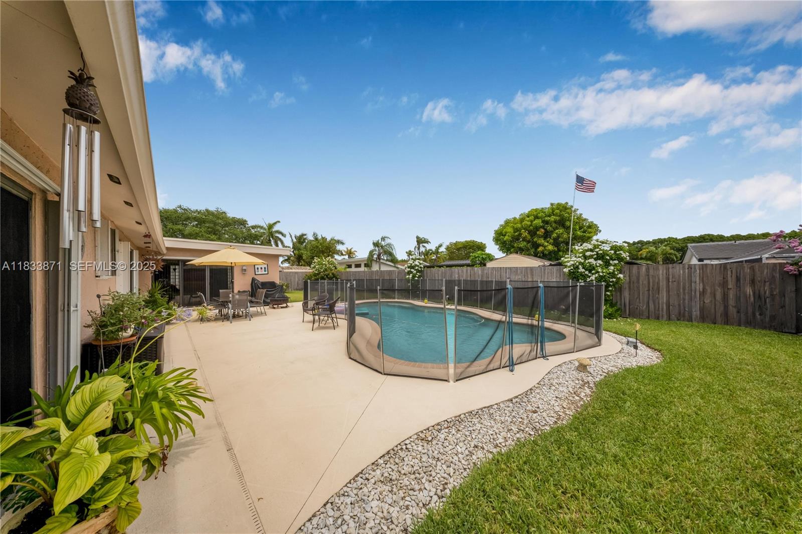 11193 Southwest 113th Terrace Miami, FL 33176 - Photo 32 of 43 a view of a swimming pool with a yard