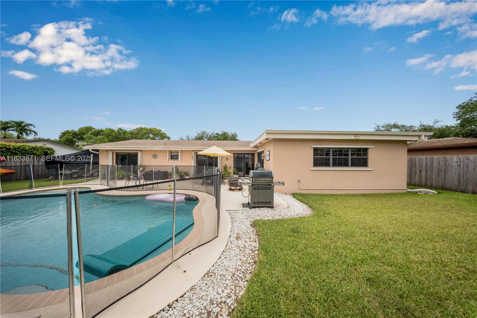 11193 Southwest 113th Terrace Miami, FL 33176 - Photo 34 of 43 a view of a house with pool yard and a wooden deck