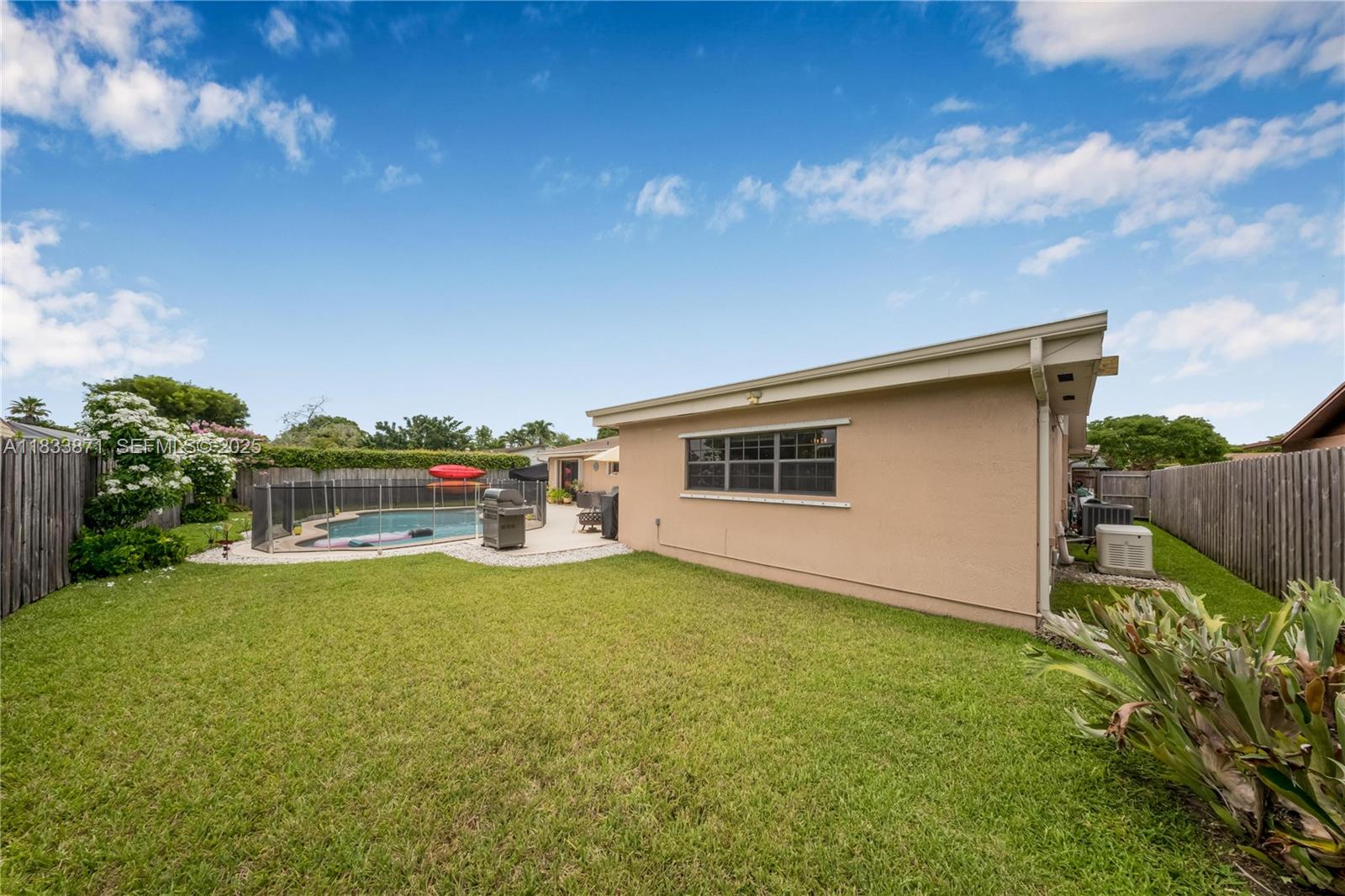 11193 Southwest 113th Terrace Miami, FL 33176 - Photo 37 of 43 a view of a backyard with plants and a patio