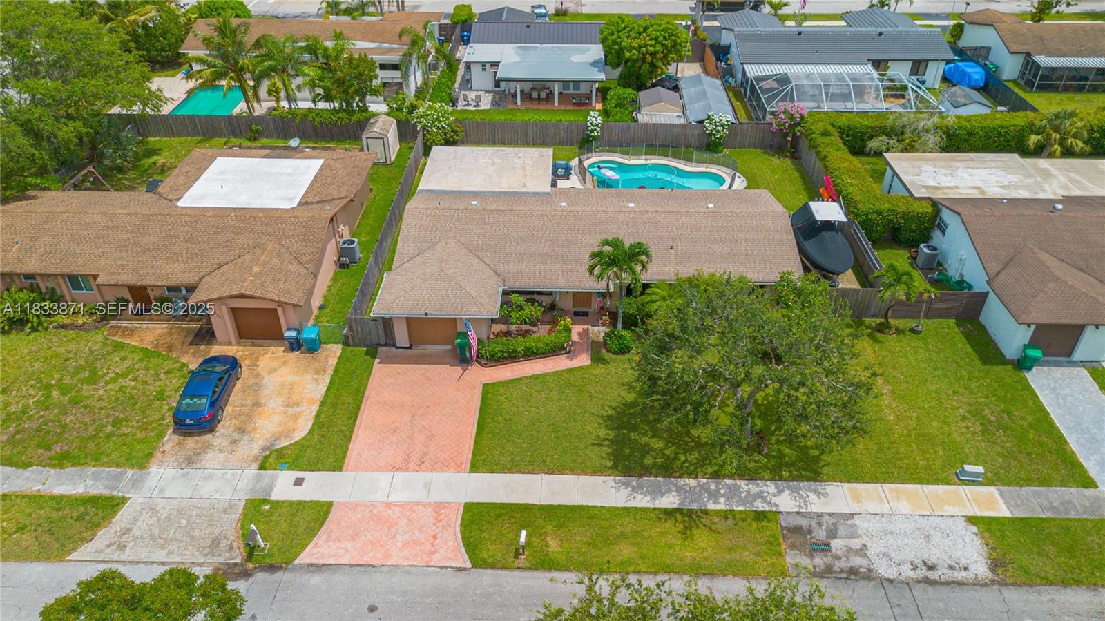 11193 Southwest 113th Terrace Miami, FL 33176 - Photo 42 of 43 an aerial view of multiple houses with yard