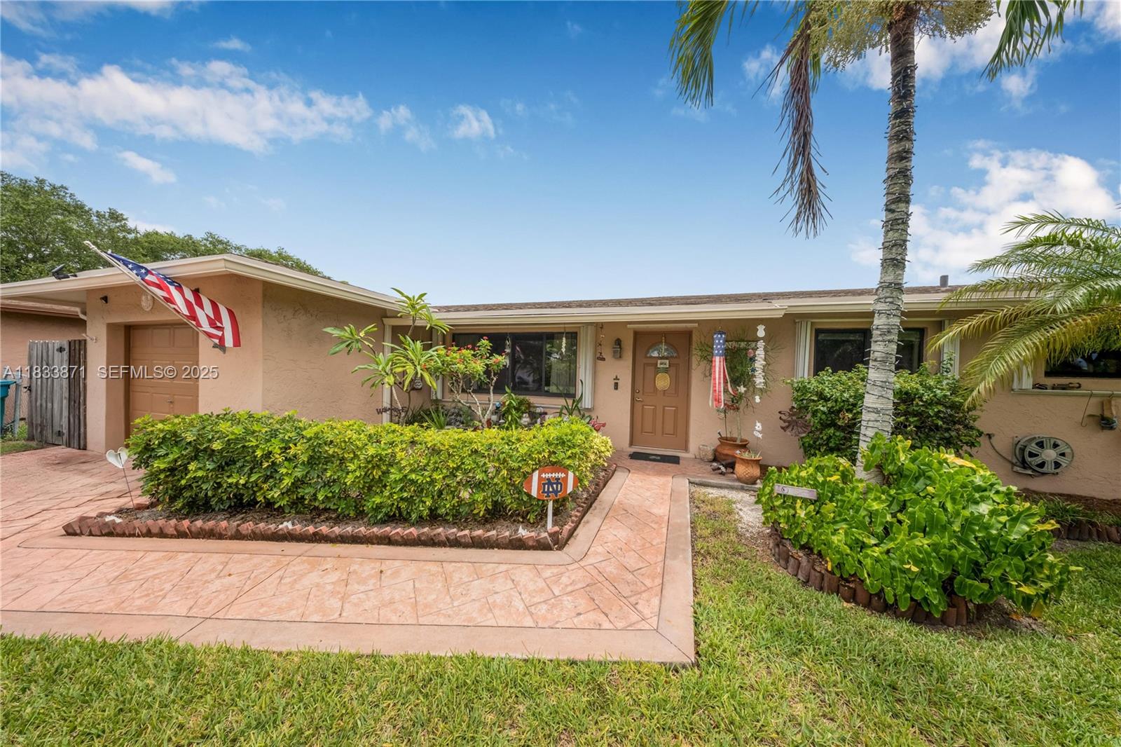 11193 Southwest 113th Terrace Miami, FL 33176 - Photo 5 of 43 a front view of a house with garden