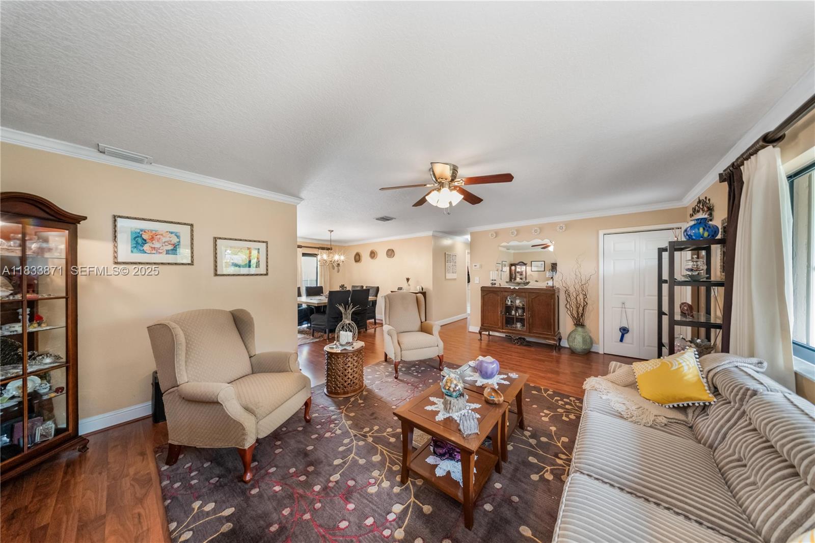 11193 Southwest 113th Terrace Miami, FL 33176 - Photo 7 of 43 a living room with furniture and wooden floor